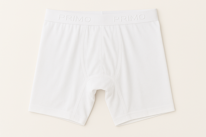 White boxer briefs with brand logo on a light beige background